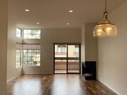 Dining, living room, balcony, fireplace facing north - 2601 S Broadmoor Dr Condo Unit 2601SoBroadmoorDrive