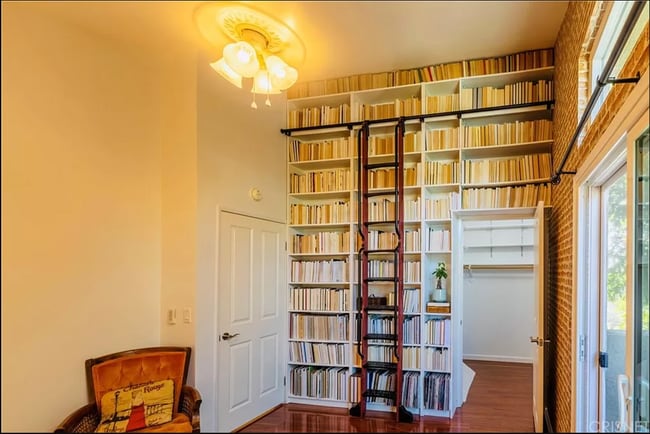 Front bedroom. Plenty of shelves for books and other items. Large walk in closet. - 1554 N Hobart Blvd Unit 2