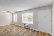 2BR, 1BA - 900SF - Living Room - Courtyards Apartments
