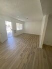 Living Room. New LVT flooring - Sunshine Apartments