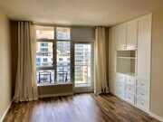 Bright Living Area with custom media center/storage - 427 9th Ave Condo Unit 907