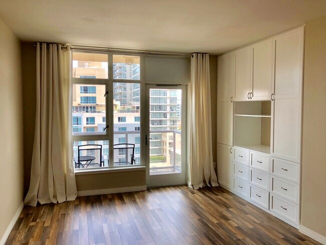 Bright Living Area with custom media center/storage - 427 9th Ave Unit 907