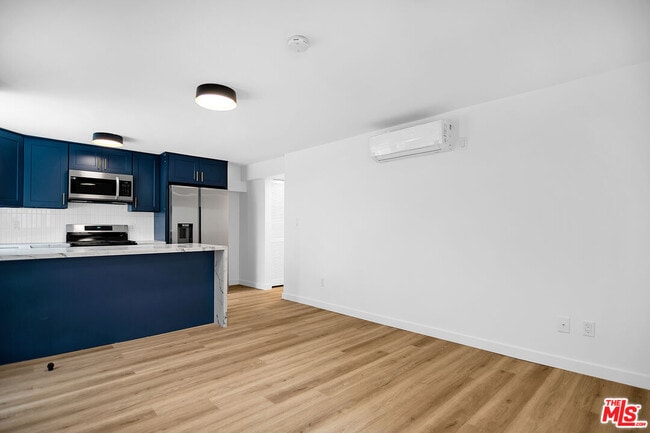 Building Photo - 1021 N Genesee Ave Unit 12