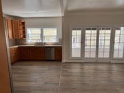Kitchen / Dining / Balcony - 1248 S Rimpau Blvd Apartment Unit 1248