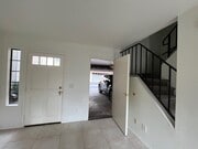living room and attached garage - 1225 N Broadway Townhome
