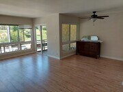 Living room, balcony - 5600 Kensington Way Unit 102