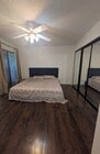 Spacious master bedroom with generous closet space and access to a connecting balcony - 5652 Yolanda Ave Unit #9