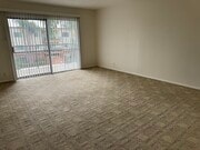 Living Room with door to patio - 400 N Acacia Ave Unit A-35