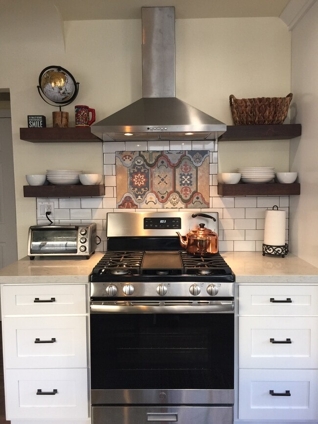 Stainless steel 5 burner gas stove and oven range. - 2120 Laverna Ave