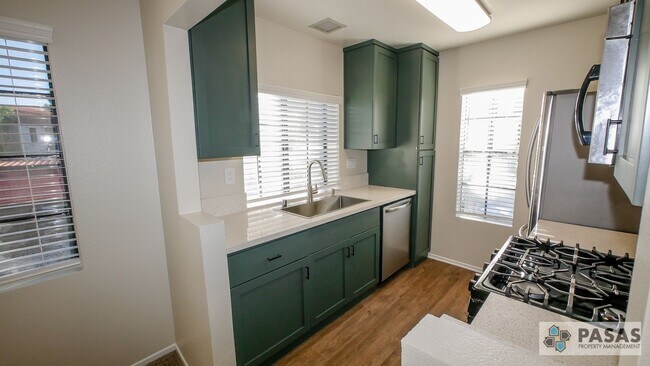 Photo - Bright Upgraded Condo w/ Quartz Kitchen, Covered Parking, Pool & Spa Unit 202