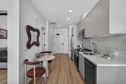 Engineered vinyl wood plank flooring in kitchen & living areas - WilWest