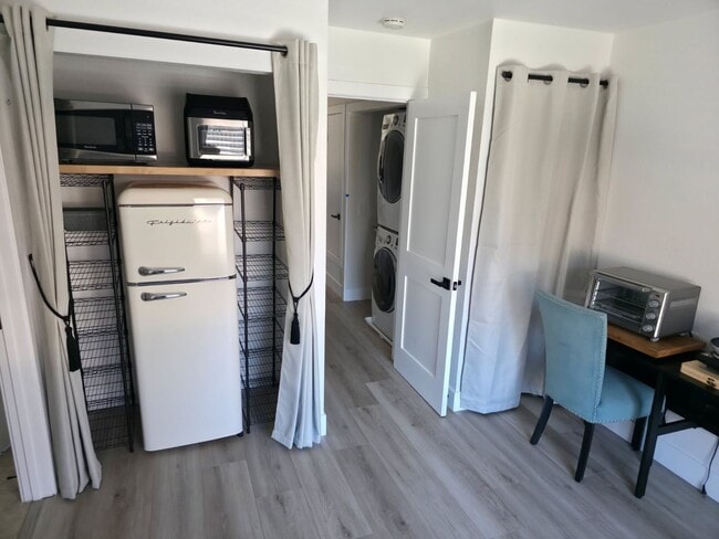 Building Photo - Furnished Bedroom rental with Bonus Kitchenette and office room