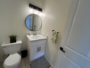 downstairs half bath with new vanity sink faucet hardware - 1225 N Broadway Townhome
