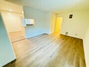 UNIT #1 LIVING ROOM - 7548 Lexington Ave Apartments