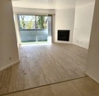 Spacious living room with private balcony - 7640 Oso Ave Unit Oso Ave