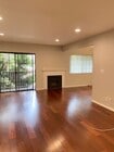 Living rm with balcony & gas fireplace - 10481 Riverside Dr Apartment Unit 10481