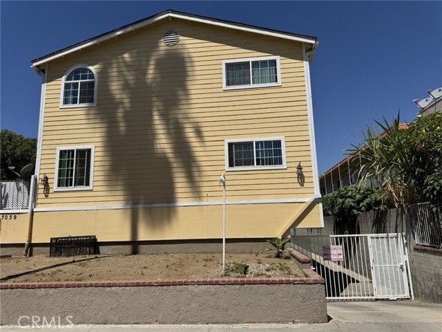 Building Photo - 7039 Remmet Ave Unit G
