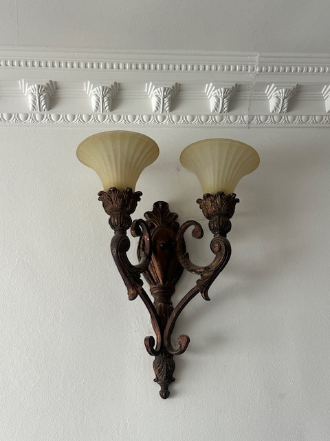 Close-up view of the right iron wall sconces on dimmer switches. - 1859 1/2 Pandora Ave Unit 1