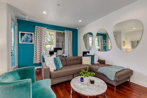 Living Room with Mounted Mirrors - 5831 Seawalk Dr