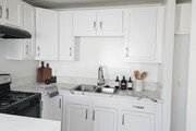 Stageed photo of kitchen - 1518 W 85th St Apartments Unit 1