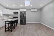 Skylight & air conditioning and heat splits ceramic tile floors throughout gallery Appliances & w/d - 4159 La Salle Ave