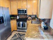 Kitchen - includes fridge, stove, built-in microwave, dishwasher - 2474 S Centinela Ave Condo Unit Centinela  4