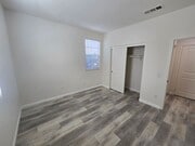 Photo - Open-Concept Living with Downstairs Bedroom & Enclosed Patio Retreat