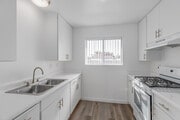 3BR, 2BA - 1,256SF - Kitchen - Villa Granada Apartments