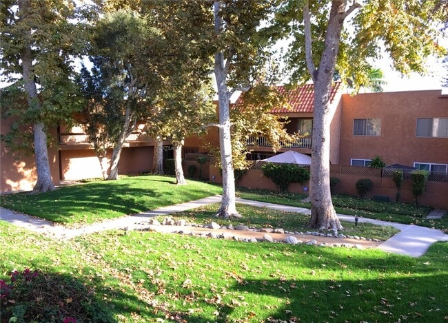 Building Photo - 6600 Warner Ave Unit 248