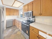 Photo - Spacious 2 BD- 2 BA Condo w/ Large Private Balcony, AC, and In-Unit W/D! Unit 203