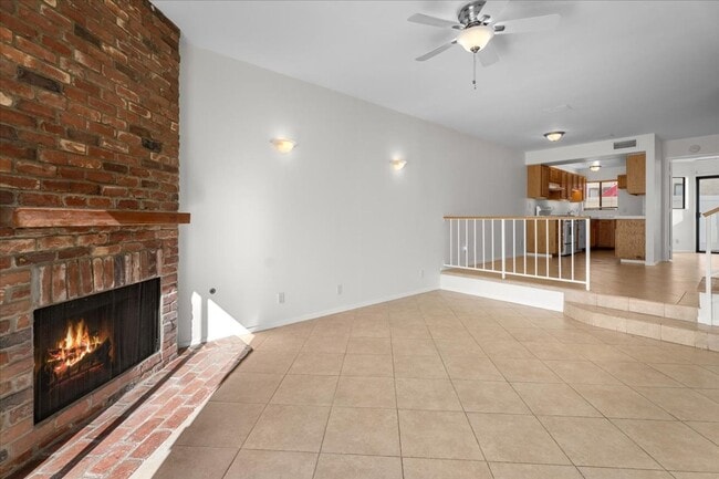 Building Photo - Light Filled Townhome Style Condo with Private Patios and Direct Access
