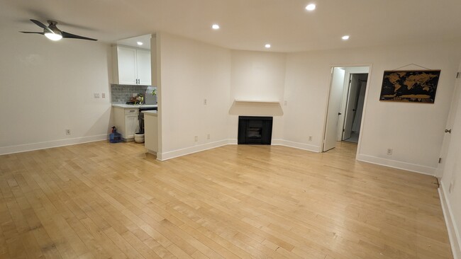Entry way, living room, fireplace, dinning room. - 3131 S Canfield Ave Condo Unit Canfield