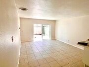 Downstairs View of living room to private patio Apt B - 619 W Provential Dr Unit Apt B