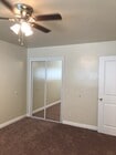 Master bedroom is newly carpeted with large closet and mirrored doors. - 9226 Palm St Unit B