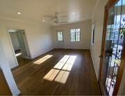 Living room / Front door entrance (Right). Open doorway (Left) leads to hallway for bedrooms/bath - 1733 Phillips Way