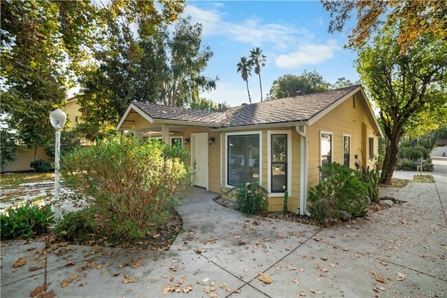 Photo - Tucked away behind gorgeous grand gates is this beautifully updated 3 bedroom 2 bath home