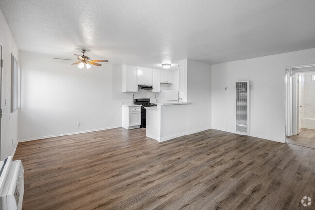 1BR, 1BA - 788SF - Living Room and Dining Room - Los Arcos Apartments