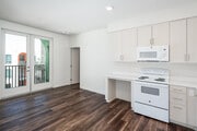 3BR, 2BA - 905SF - Kitchen and Living Room - Archways Santa Ana