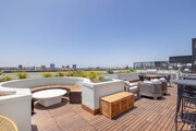 Find your community at Bloom’s rooftop retreat, the perfect spot to connect, relax, and savor stunni - Bloom Beverly Grove - Upscale Co-Living