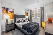 2BR, 2BA - 1038SF - Primary Bedroom - Broadway Palace Apartments