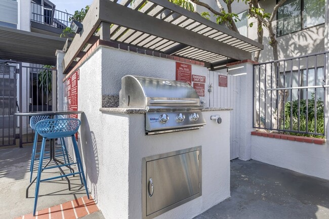 Grill, chill, and unwind in style at Independence Plaza - where every patio is a personal oasis. - Independence Plaza Apartment Homes