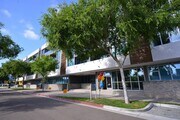 Nice tree-lined sidewalk in front of 12th Street Lofts in National City, California. - 12th Street Lofts