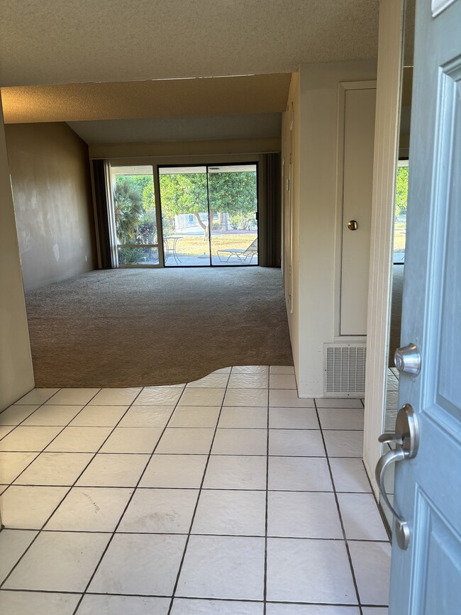 entryway into spacious living/dining roon - 1902 Grand Bahama Dr E Unit Palm Springs Condo