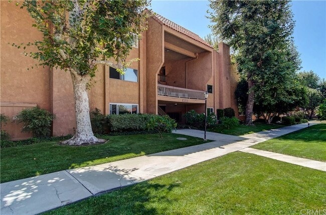 Building Photo - 6600 Warner Ave Unit 178