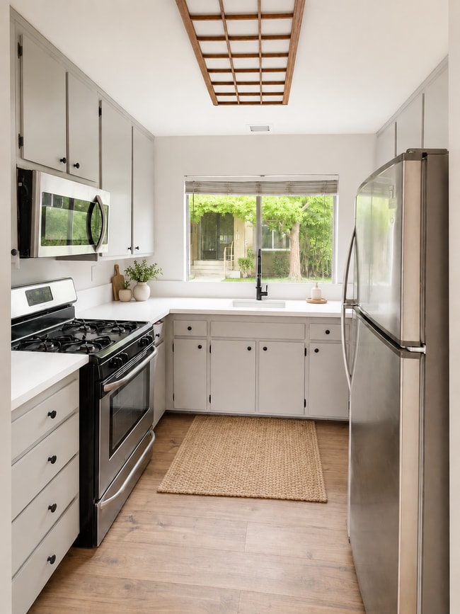 Photo - Fully Renovated 3 Bed Townhome with Large Enclosed Patio + 2-Car Garage
