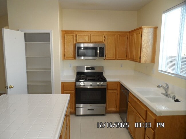 Photo - 4 Bedrooms, 2 Bathrooms, 3 Car Garage, 1899 sq. ft., Large Fenced, Front Yard Lawn, Near Schools ...