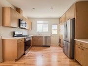 Kitchen with brand new stainless steel appliances, quartz countertops, and maple cabinets - 1041 Wilcox Ave Unit 1041