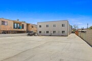 Back of Prop/Parking Lot - 649 W 92nd St Apartments