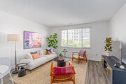 1BR, 1.5BA - 865SF - Living Room - GEMA