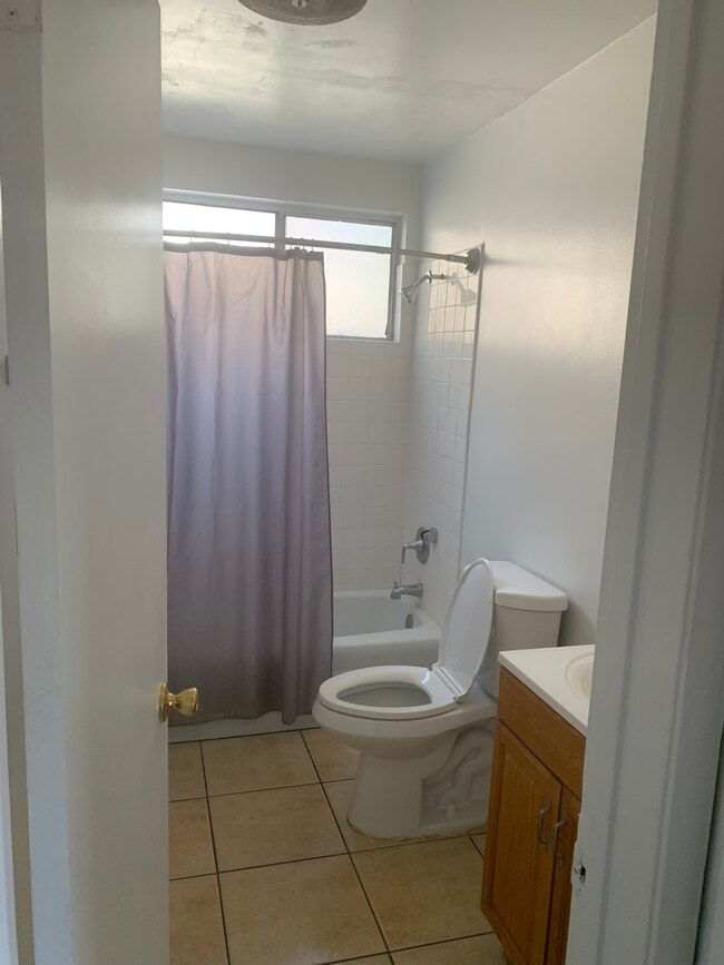 Bathroom with shower and tub - 4211 11th St Unit 4211